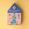 A 36-piece reversible puzzle in a house shaped box on a yellow background 