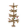 Decorative Christmas tree with gold tinsel, colorful ornaments, and a wooden base on a white background