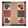 Patchwork blanket with heart and plaid patterns on a white background