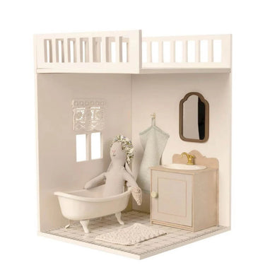 Miniature Maileg dollhouse bathroom with bathtub, sink, and mirror.
