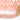 Close up of a dress up crown with a pink headband with gold accents on a white background