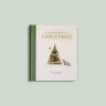 Book titled 'Our Little Adventure at Christmas' with a Christmas tree and reindeer illustration on a light green background.