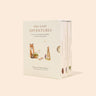 Book box set titled 'Our Little Adventures' with illustrations of a fox and rabbit on a beige background. It has three small books in a matching sleeve.  