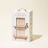 A white box with a leather handle titled 'Our Very Little Library' with illustrations of books and a teddy bear, and ten mini books inside.