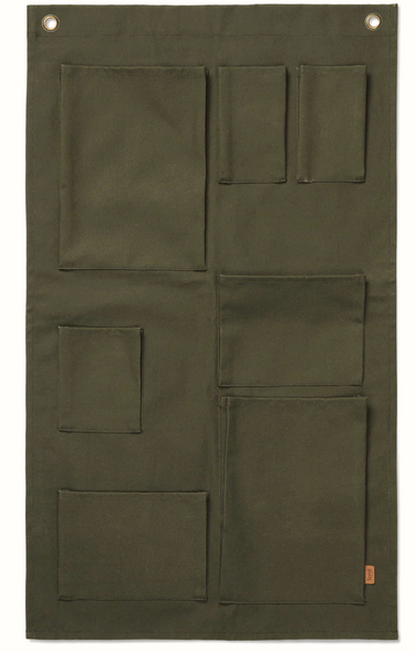Green fabric panel organiser with multiple pockets on a white background