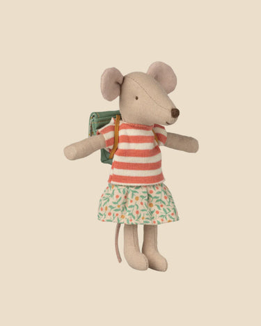 Stuffed mouse toy wearing a striped shirt and floral skirt on a beige background