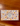 A rectangular box of Billes & Co. Ocean Coquillages (58 pieces) featuring a beige background decorated with colorful illustrations of starfish, seashells, and waves, placed on a wooden table.