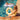 Two children playing in a pool with inflatable rings.