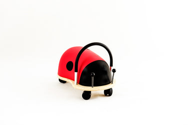 Red and black toy vehicle on a white background