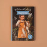 A book called Wild Craft Club with a picture of a girl making a wall hang 