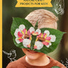 A booked called Wild Imagination with a photo of a boy in a mask made from leaves and flowers