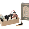 A boxed set of winter-themed ornaments and a matching decorative box on a white background. The set includes two snowman ornaments in black clothing with red and light blue scarves, a black boot ornament, and a black sled ornament, alongside a tall decorative box labeled 'Winter Wonderland'.