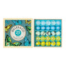 Glass marbles in a box with butterfly pictures on a white background 