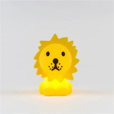 Yellow lion-shaped night light on a white background