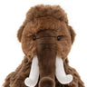 A brown plush woolly mammoth toy with long white tusks, photographed against a plain white background.