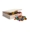 A wooden box with a gold clasp with brightly coloured gems spilling out on a white background