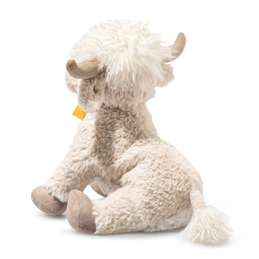 Plush toy yak with a yellow tag on a white background
