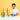 A smiling young boy in a white t-shirt stands behind a colorful magnetic marble run toy set on a white table against a solid yellow background.