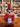 Pink plush phoenix with a tag on a wooden surface in a store setting
