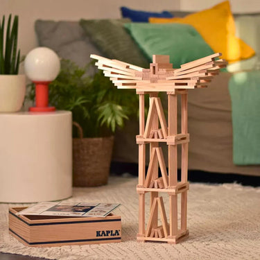 Wooden construction set on a table with a blurred living room background