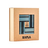 A brown box with name Kapla and light blue and dark blue planks inside on a white background