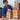 Child playing with wooden blocks, building towers indoors.