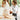 two girls building a structures made using the Kapla Building blocks with a teddybear in the background