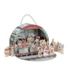 A wooden Christmas train station playset inside a dome-shaped storage box with a carrying handle. The set includes a small train, station platform, signposts, and wooden characters including Santa Claus, a snowman, and children, all on a white background.