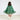 A child viewed from behind wearing a green tiered tulle cape with embroidered decorative details, a pale pink dress, white socks, and a gold star headpiece against a plain light background.