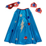 Blue superhero cape with star and lightning bolt designs, accompanied by a red mask and hats on a white background.