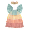 Pastel tiered dress with a gold glitter crown on a white background