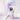 Young girl in a colorful dress holding a purple fabric and a star wand in a softly lit room.