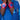 Person wearing red wristbands with blue stars on a blue outfit.