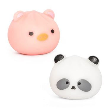 Pink pig and white panda squishy toys on a white background