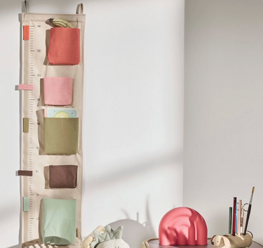Danish designed growth chart hanging on wall