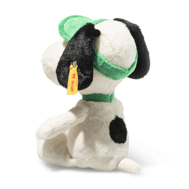 Plush Snoopy dog toy with green headband and collar on a white background