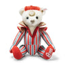 Stuffed teddy bear with red and gray striped outfit on a white background