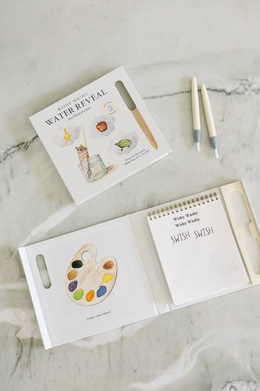 Wishy Washy: Water Reveal Edition Children's book with watercolor illustrations on a marble surface